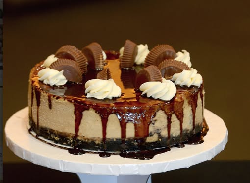 Reese's peanut butter cup cheesecake with chocolate drizzle